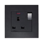 Black 13A switched socket outlet with illuminated on/off switch and metallic insert, mounted on square black faceplate.