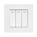 White 3-gang 2-way light switch with three rectangular buttons and indicator lights mounted on wall plate.