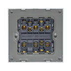 Rear view of electrical switch showing brass terminal connections and rated 16AX 250V specifications on dark gray backing pla