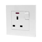 White 13A switched socket outlet with on/off toggle switch and indicator light, mounted on white wall plate.