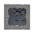 Interior view of white 1-gang switched socket showing black mechanism with three brass terminal connections and mounting plat