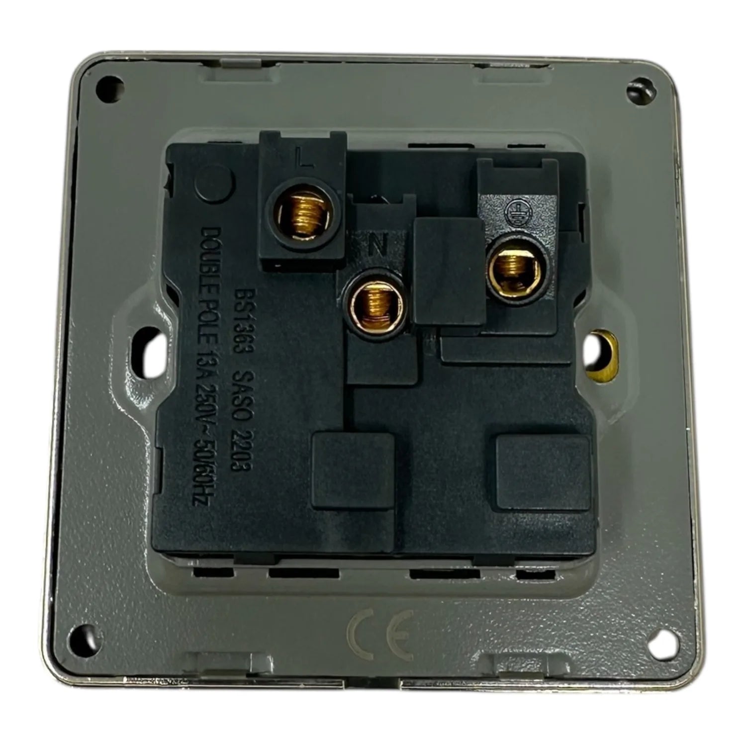 Rear view of 13A switched socket showing internal wiring terminals and brass contact points on gray backing plate.