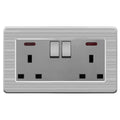 Brushed stainless steel 2-gang switched socket outlet with two toggle switches and indicator lights, product shot on white ba