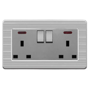 Brushed stainless steel 2-gang switched socket outlet with two toggle switches and indicator lights, product shot on white ba