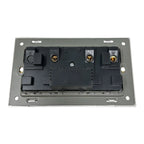 Rear view of a 2-gang electrical socket with internal wiring terminals and brass contacts mounted on gray backing plate.