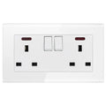 White tempered glass electrical outlet plate with two switched sockets, USB ports, and indicator lights.