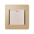 Brushed gold 1-gang 2-way light switch with white button and indicator light, product shot on white background.