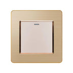 Brushed gold 1-gang 2-way light switch with white button and indicator light, product shot on white background.