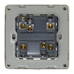 Rear view of 2-gang 2-way light switch showing brass terminal connections and rating plate, mounted in gray faceplate.