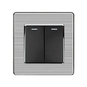 Two-gang two-way light switch with brushed steel plate and black rocker switches, front product view.