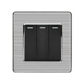Three-gang two-way light switch with black rockers on brushed steel faceplate, product shot.