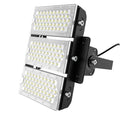 Three-panel stacked LED flood light with white lens covers and black mounting bracket against white background.