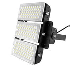 Three-panel stacked LED flood light with white lens covers and black mounting bracket against white background.