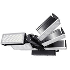Four-head adjustable LED flood light with white lamp heads and black mounting bracket against white background.