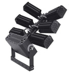 Black multi-head LED flood light fixture with pivoting arms mounted on base, product studio shot.