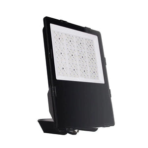 Black LED flood light with square white light panel and mounting bracket, tilted against white background.