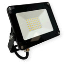 Black LED flood light with white reflector panel and yellow square LEDs, shown at angle against white background.