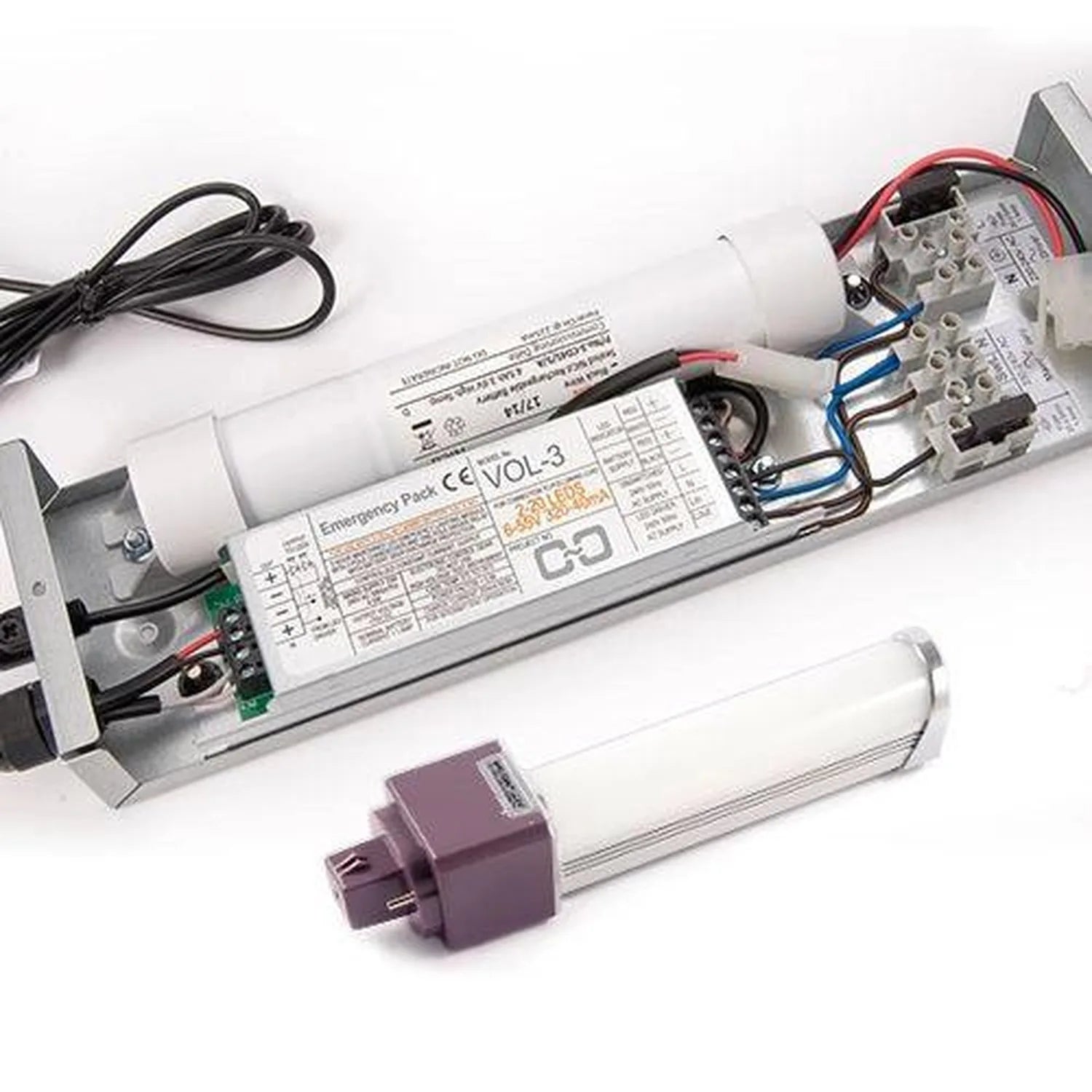 Emergency lighting conversion kit components displayed, including ballast, battery pack, connector, and fluorescent tube with