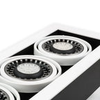 White recessed ceiling fixture with two visible LED spotlights featuring black gimbal rings and white trim, mounted in drywal