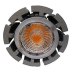 Top-down view of a round GU10 LED spot light with gray trim ring and orange-tinted LED visible through clear lens, surrounded