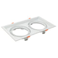 White rectangular recessed ceiling light fixture with two oval openings and orange adjustment tabs, product shot on white bac