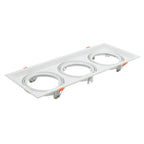 White rectangular triple recessed light fixture with three circular gimbal housings and orange adjustment clips, product shot