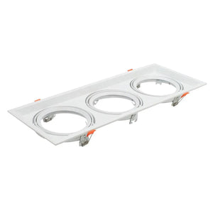 White rectangular triple recessed light fixture with three circular gimbal housings and orange adjustment clips, product shot