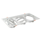 White recessed triple gimbal housing with orange adjustment tabs and spring clips, shown from above at an angle.