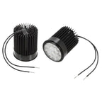 Two LED downlight modules shown front and back view, featuring cylindrical black bodies with finned heatsinks and attached po