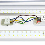 Installation shot of LED ceiling light showing wired electrical connectors and yellow LED modules mounted on white fixture fr