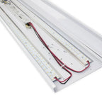 Multiple LED light panels with red and black wiring arranged parallel, showing dense array of small LED bulbs on white alumin