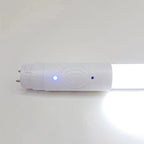T8 LED tube light with white housing, showing blue power indicator light and motion sensor panel on cylindrical ballast end.