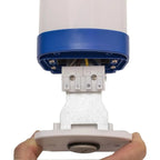 Blue LED tri-proof light fixture with terminal connections exposed, held in hands showing installation detail.