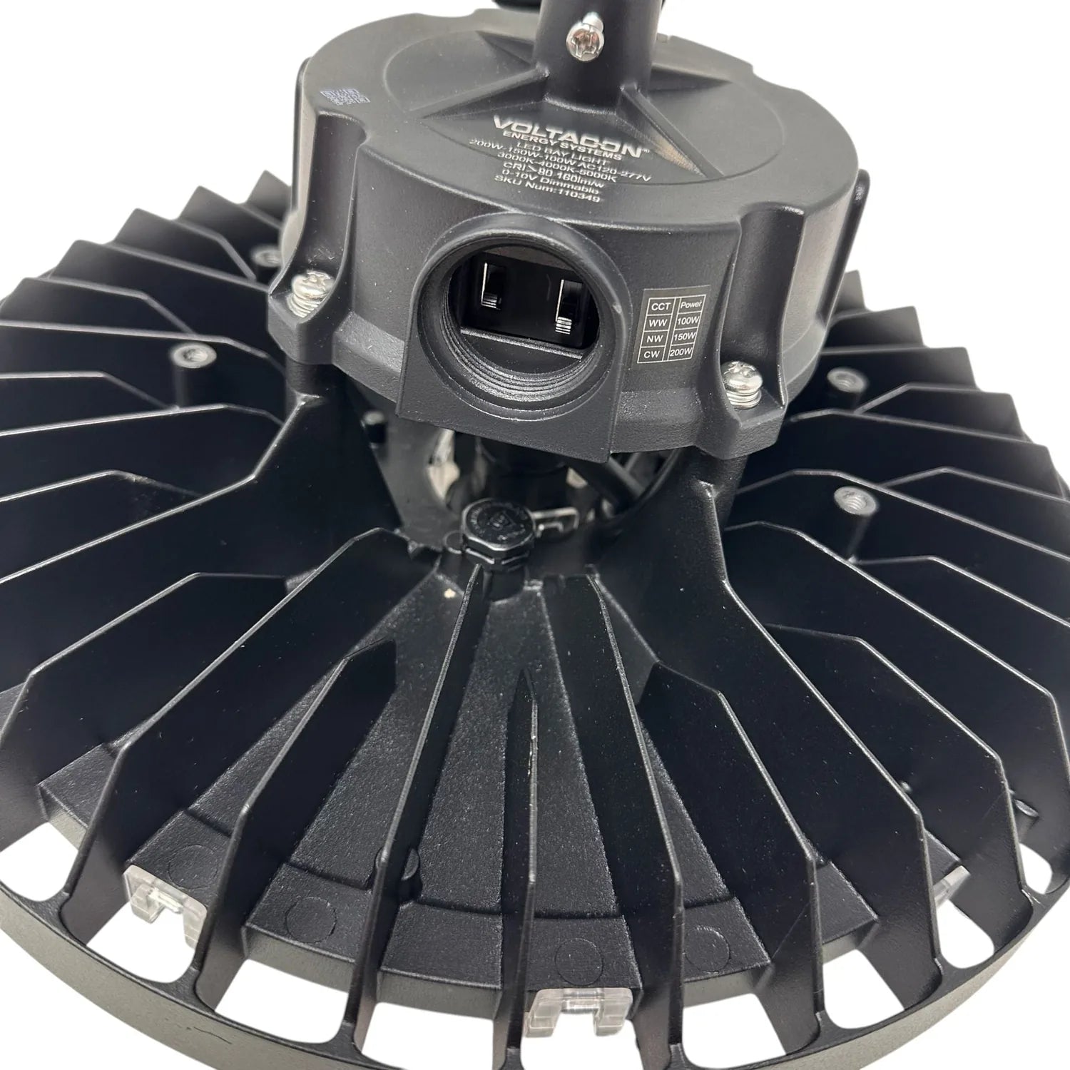 Voltaron LED high bay light fixture viewed from below, showing black radial heat sink fins and central optical head with moun
