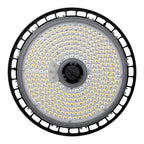 Top-down view of round LED high bay light with black rim, gray face plate, and hundreds of small yellow-toned LED chips arran