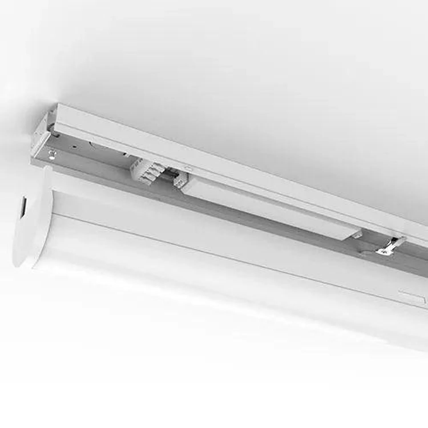 Slim LED batten light fixture mounted horizontally on white ceiling, showing internal track mechanism and electrical componen