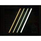 Four illuminated LED tube lights in warm white, neutral white, cool white, and daylight color temperatures displayed against 