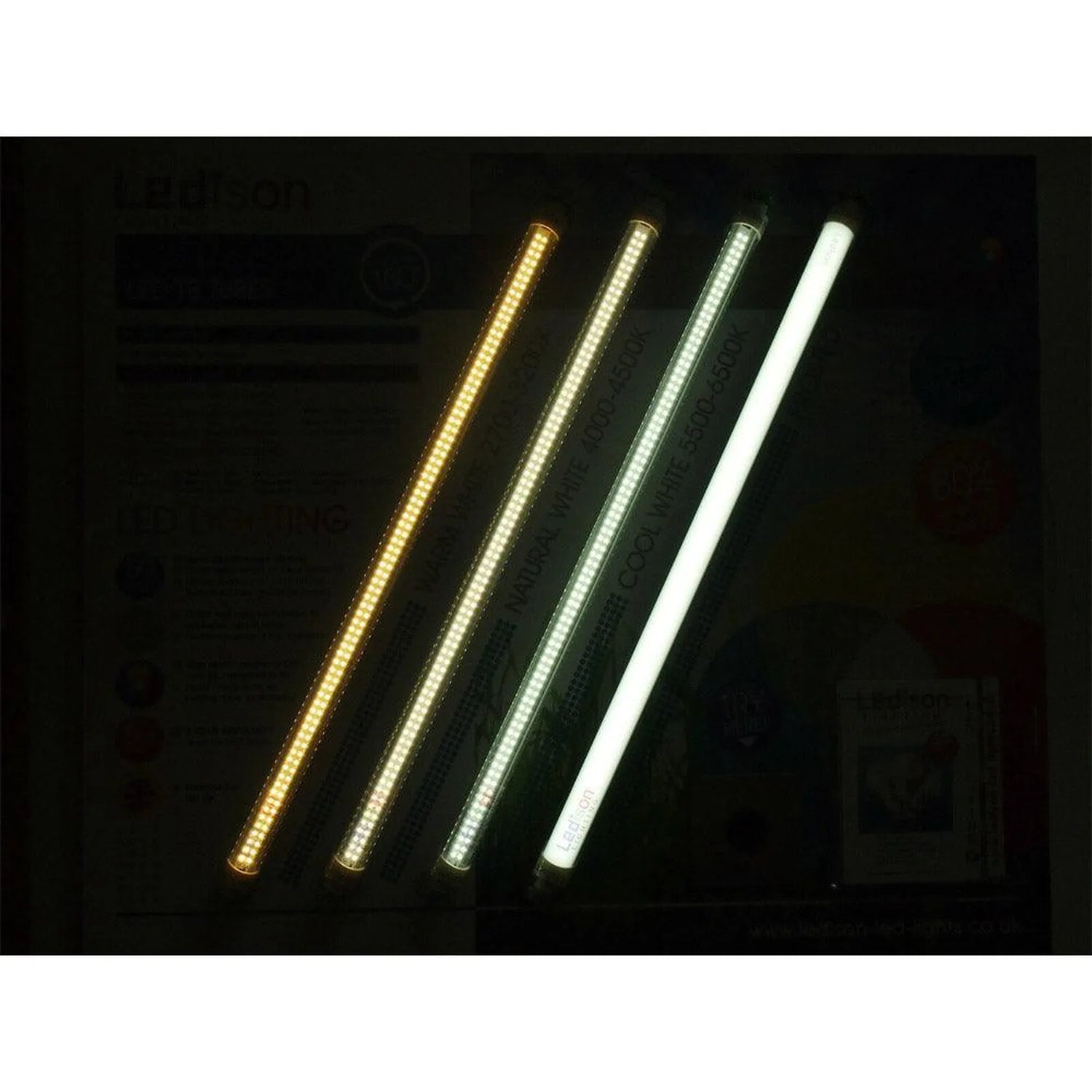 Four illuminated T8 LED tubes in warm white, neutral white, cool white, and daylight color temperatures displayed side by sid