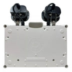 Top-down view of white emergency spotlight fixture showing dual black lamp heads and mounting surface with circular fixture o