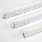 Three white LED tube lights with integrated switches arranged diagonally on light gray background, product display shot.