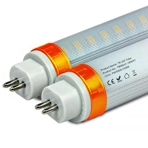 Two T5 LED tube lights with white end caps and orange temperature bands, showing product label and specifications on tube sur