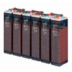 Six Hoppecke OPzS Solar 910 flooded lead acid battery cells arranged in a row, showing tall reddish-brown cases with blue top