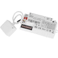 White rectangular LED driver unit with attached microwave sensor and white cable, showing circuit board and terminal connecti