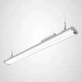 Silver cylindrical LED high bay light suspended by two cables against white background.