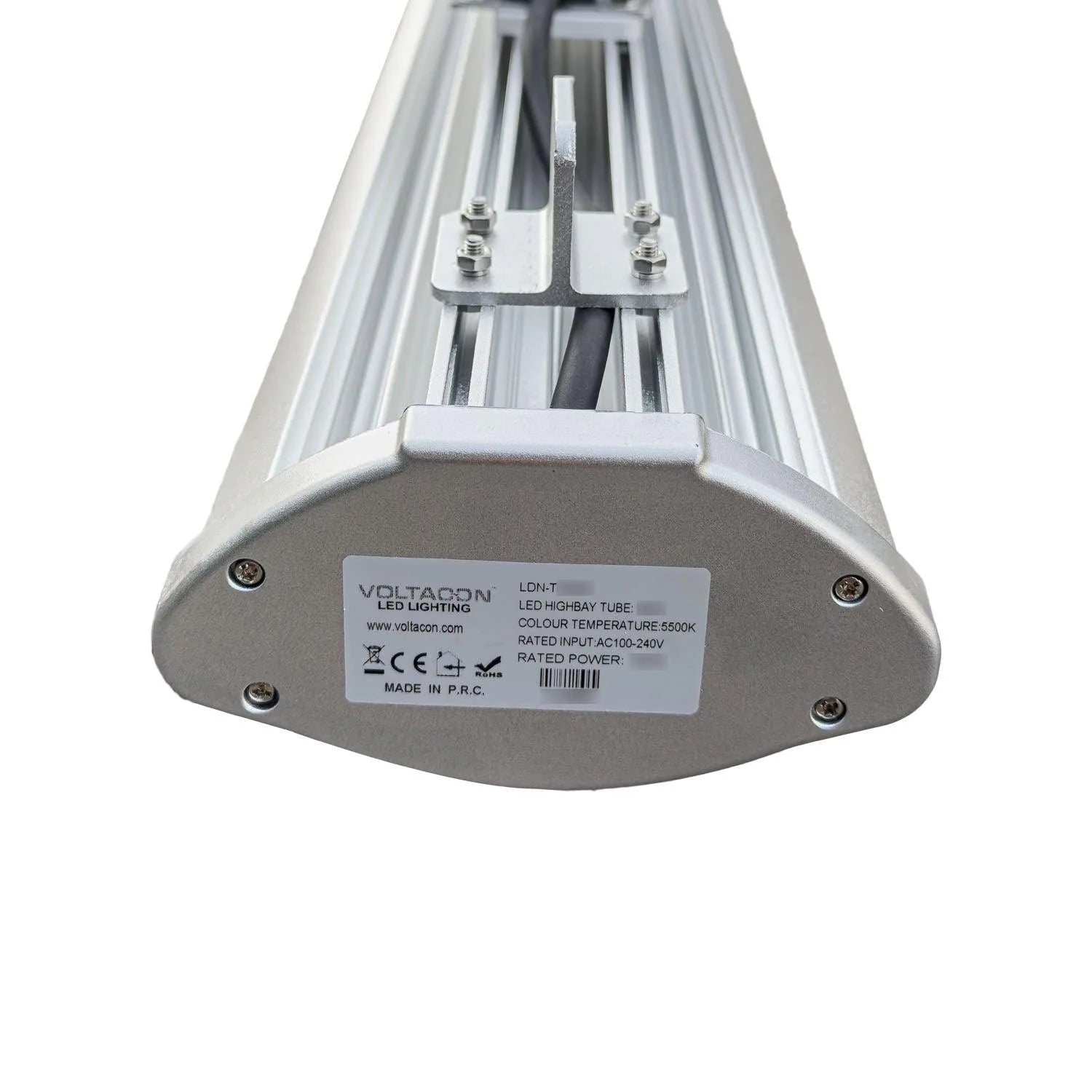 Bottom view of Voltacon LED high bay tube showing manufacturer label, mounting hardware, and specifications including 5500K c