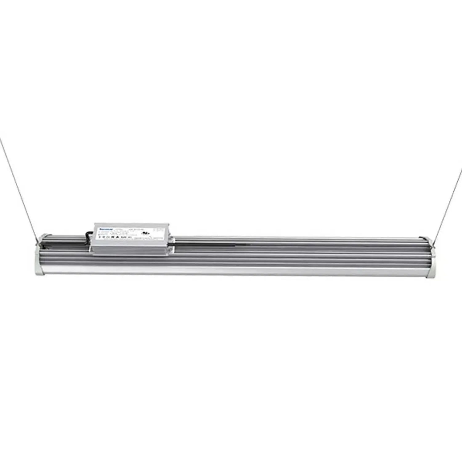 Linear LED high bay light fixture with aluminum housing and control unit, suspended by two cables against white background.