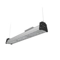 Linear LED high bay light with aluminum housing, black end caps, and mounting hardware against white background.