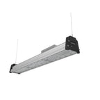 Linear LED high bay light with aluminum housing, black end caps, and mounting hardware against white background.