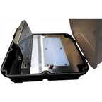 LED wall pack light fixture disassembled showing internal components including LED panel with yellow diodes, metal heat sink,