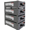 Four stacked gray battery modules with black connectors, orange switches, and red/white control buttons mounted on a steel fr